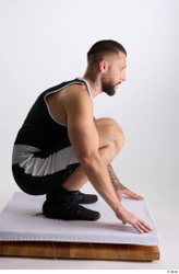 Whole Body Man White Sports Shorts Slim Athletic Kneeling Top Studio photo references